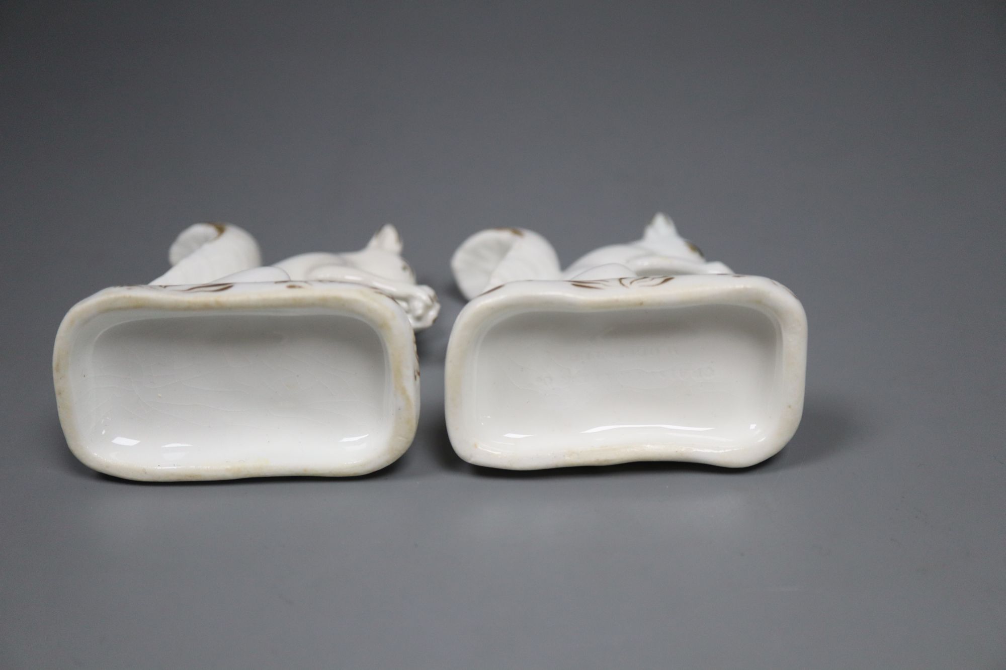 A pair of Grainger, Lee & Co. gilt and white porcelain figures of squirrels, c.1820-37, 6.5cm high